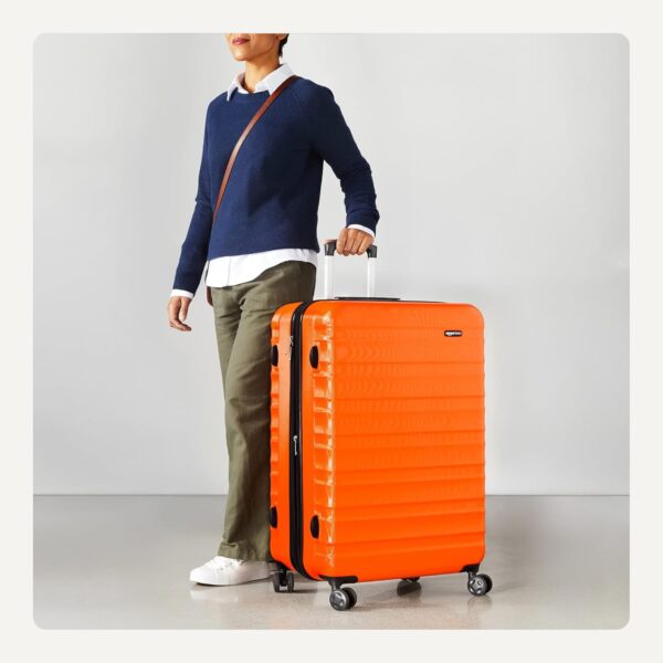 Amazon Basics 30" Hardside Large Checked Luggage, Hardshell Suitcase With Wheels, Expandable For Up to 15% More Space, With Scratch-Resistant Surface, Four Multi-directional Wheels, Orange - Image 3